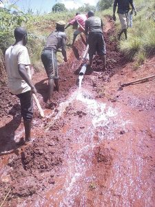 The water pipeline in Gitega, Burundi is layed by hand.