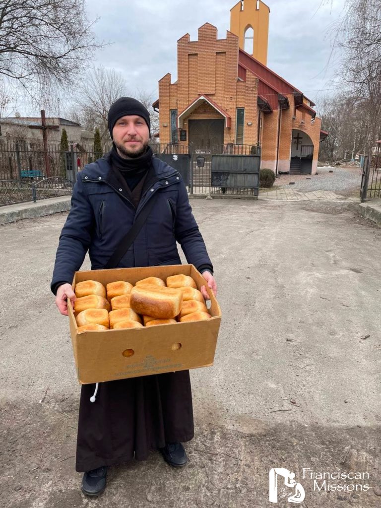 A Franciscan brother delivering bread as part of the relief for Ukraine.