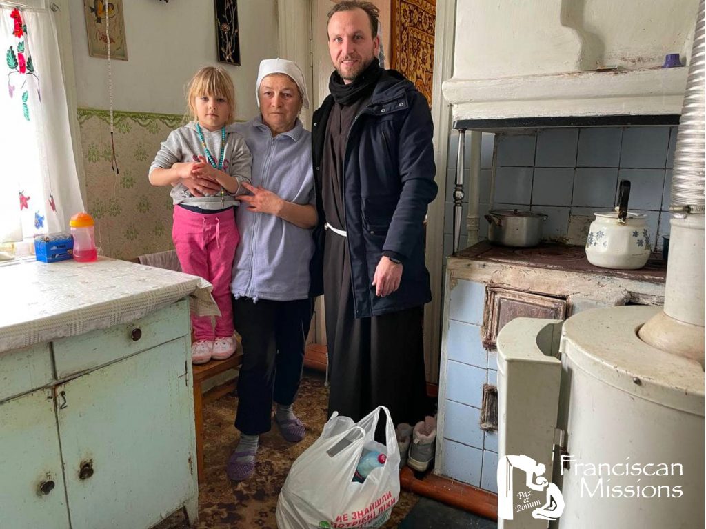 A Franciscan brother delivers groceries to a family as part of the relief efforts in Ukraine.