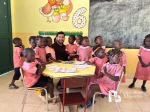 Guinae-Bissau school children, Well water, clean water, Franciscan Missions, Franciscan missionary with school children