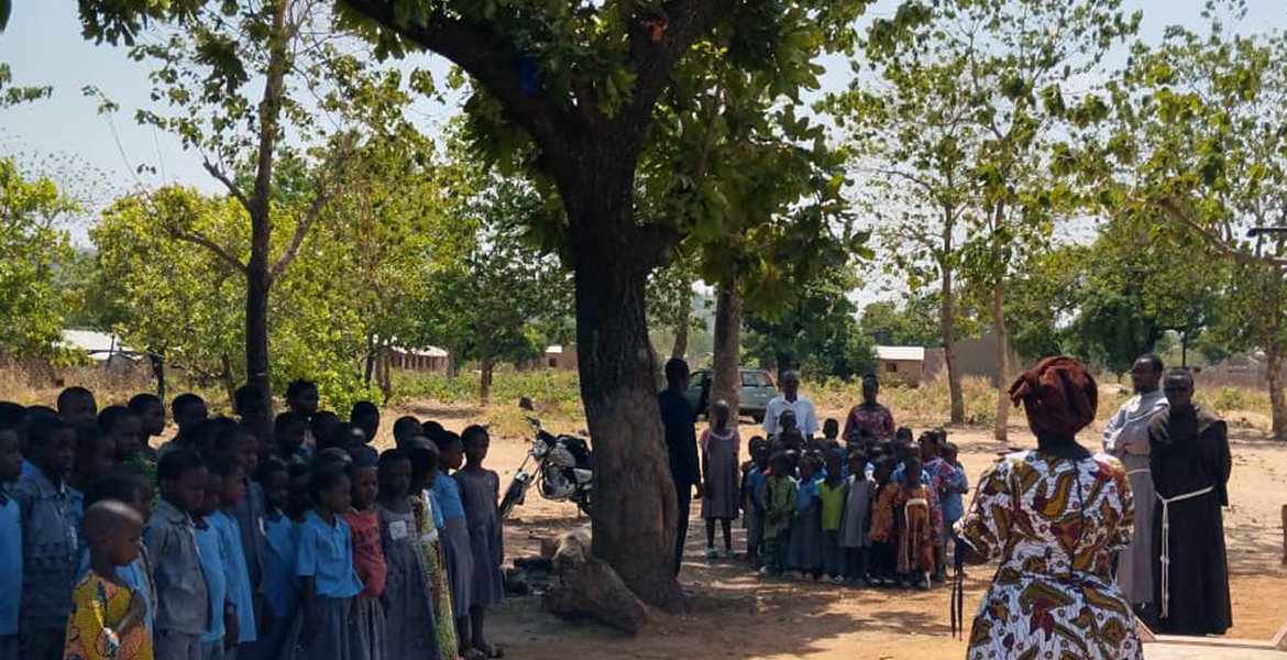 gathering-in-front-of-the-new-well-with-schoolchildren-and-friars