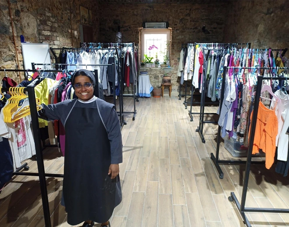 Sister-Bindhu-(India)-with-new-racks-for-used-clothing