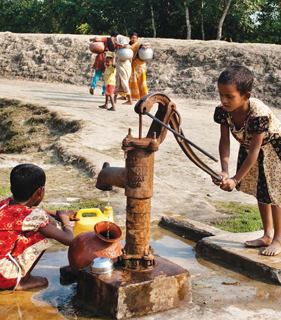 two-children-pumping-water-from-a-well