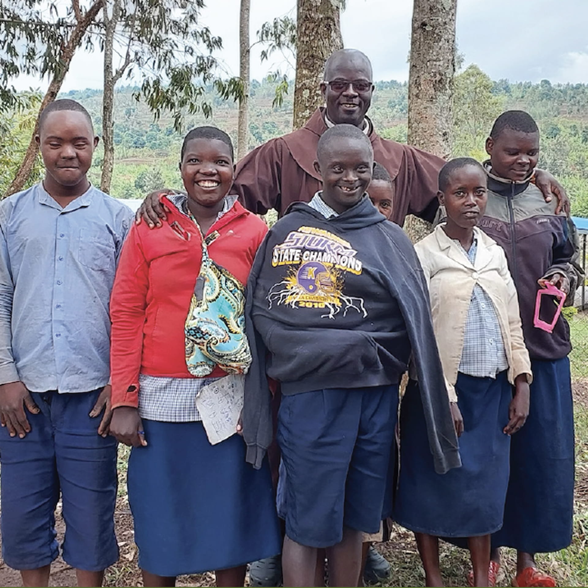 Franciscan missionary baptizes a child in the Amazons of Brazil